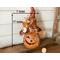 This is a fall Halloween witch decoration. It is 17 inches tall and 7 inches wide. It is a carved gourd with a handmade witch hat. T